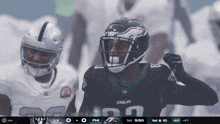 a philadelphia eagles football player celebrates a touchdown against the raiders
