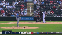 a baseball game is being played in front of a tlcasino.com ad