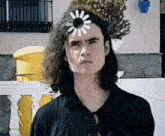 a man with a spinning wheel on his head