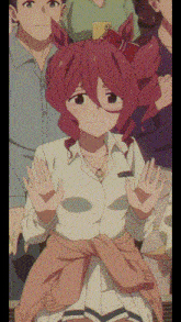 a girl with red hair is waving her hands in front of a group of people