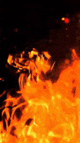a painting of a fire with a black background and orange flames