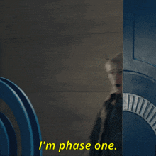 a woman with horns says " i 'm phase one " in yellow letters