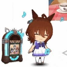 a little girl is standing next to a jukebox and a cup of coffee on a table .