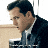 a man in a suit says what did you just say to me