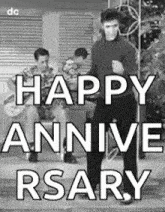 a black and white photo of elvis presley dancing with the words `` happy annive rsary '' .
