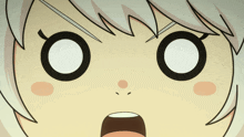 a close up of a girl 's face with a surprised expression