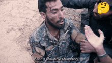 a man in a military uniform is talking to another man with the words kafir inaudible mumbling