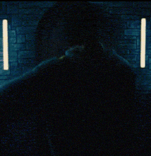 a dark blue background with a yellow light coming out of it