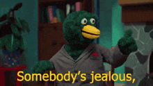 a stuffed animal giving a thumbs up with the words somebody 's jealous behind it