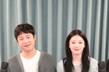 a man and a woman standing next to each other