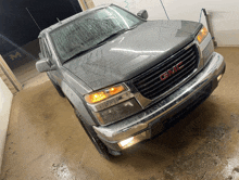 a gmc truck is sitting in a garage