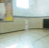 a blurry picture of a basketball court with a painting on the wall behind it