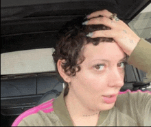 a woman with a tattoo on her arm that says heaven