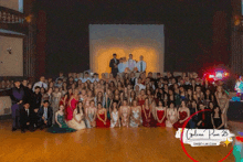 a large group of people posing for a photo with galena prom 25