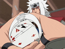 a cartoon character holding a pile of playing cards with a chinese symbol on his head