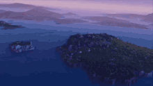 a small island in the middle of a body of water with a large explosion in the background