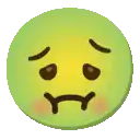 a green smiley face with a sad look on its face