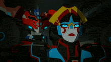 a couple of transformers standing next to each other with one of them having the number 11 on it