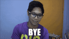 a young man wearing glasses and a purple shirt says bye