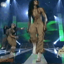 a group of people are dancing on a stage and the word podios is on the bottom
