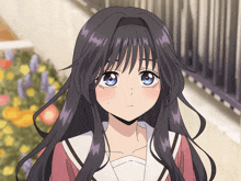 a girl with purple hair and blue eyes is looking at the camera