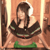 a woman wearing headphones and a off the shoulder top with the letters g on it