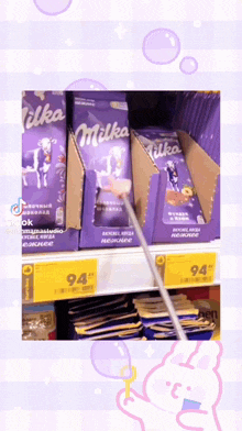 boxes of milka chocolate are on a store shelf