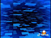 a blue background with a lot of squares floating in the air .