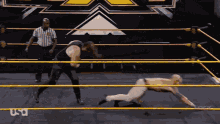 two men are wrestling in a ring with the word usa on the bottom