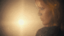 a woman 's face is shown in a blurry photo