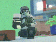 a lego soldier is standing on a table in a room with a green background .