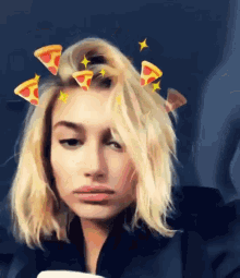 a woman with pizza slices in her hair is making a funny face