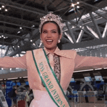 a woman with a sash that says miss grand international
