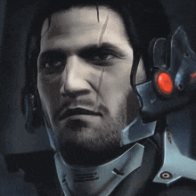 a close up of a man wearing a helmet with a red light on it