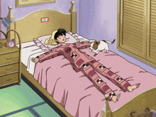 a girl is laying on a bed with a cat on it