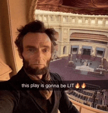 a man with a beard is taking a selfie with a caption that says this play is gonna be lit