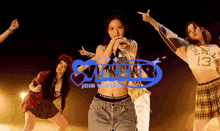 a group of women are dancing in front of a sign that says summer