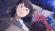 a girl with blue eyes is laying in a bed next to a pink flower