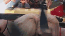 a group of people are riding on a roller coaster .