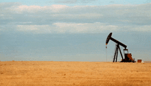 an oil pump is in the middle of a field