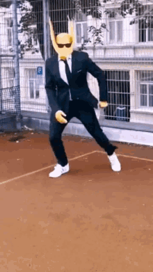 a man in a suit and tie is dancing on a tennis court