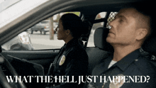 a man and a woman in a police car with the words what the hell just happened below them