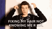 shawn mendes fixing hair not knowing we r lol