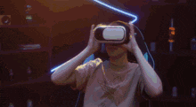 a person wearing a virtual reality headset with playing cards coming out of it .