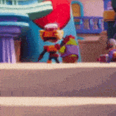 a cartoon character is standing in front of a building with a red heart on it .