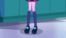 a girl with purple socks and black shoes is standing on a purple surface