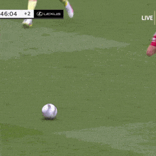 a soccer player with the number 2 on his shirt is laying on the ground