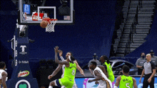 a basketball game is being played in front of a sign that says libman on it