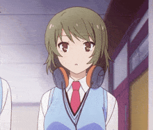 a girl wearing headphones and a red tie looks at the camera