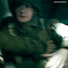 a blurry picture of a soldier with josephquinngifs written on the bottom